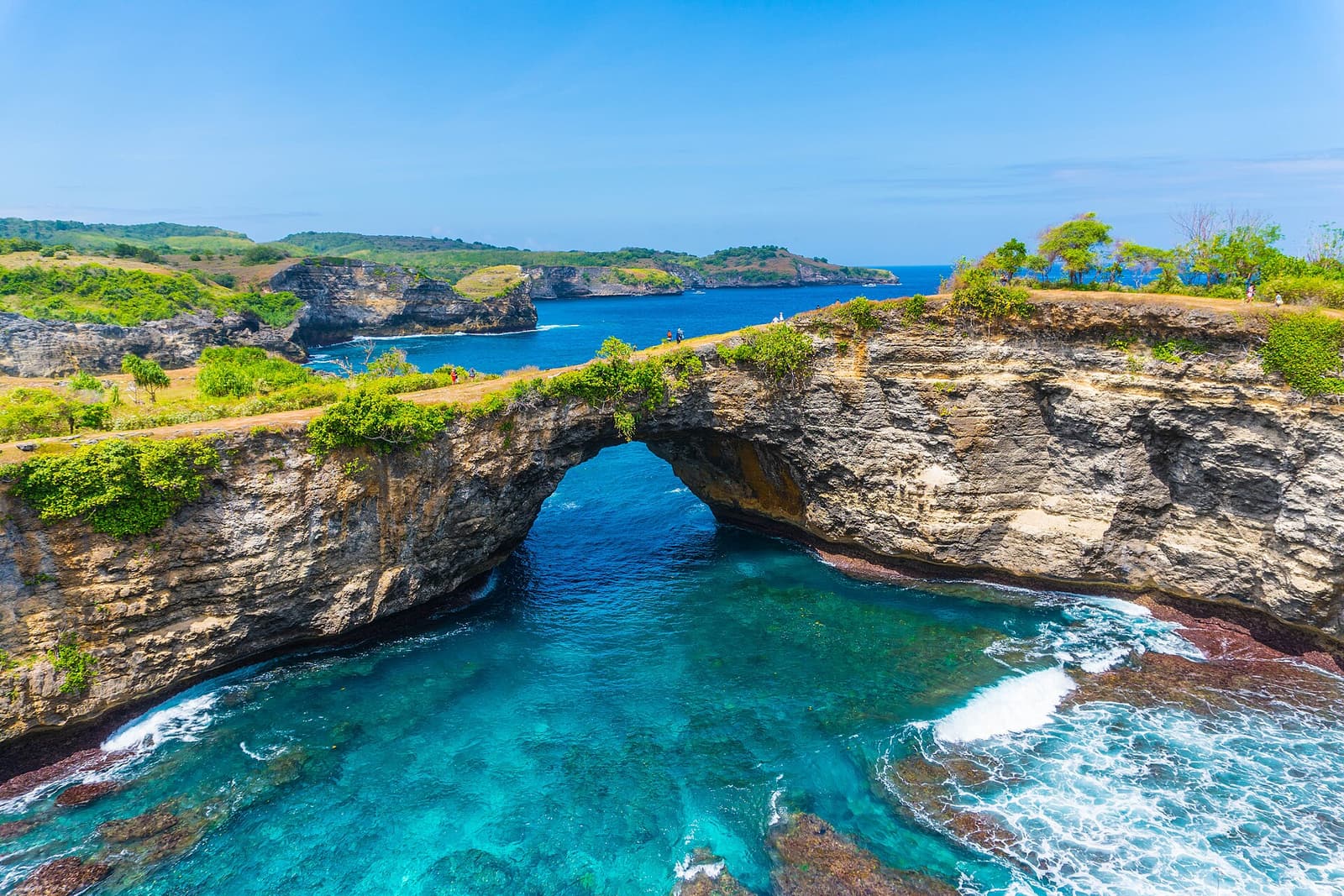 The natural rock arch and turquoise cove of Broken Beach, Nusa Penida